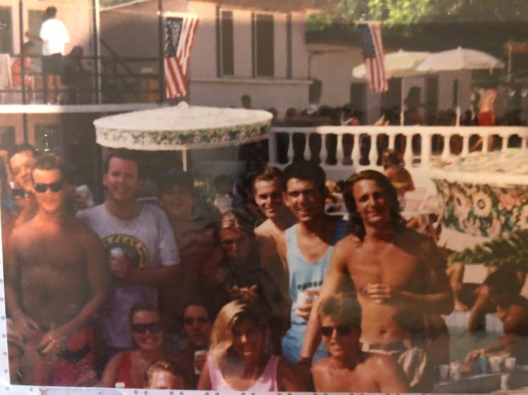 A family on the beach · the Pink Palace logo on the print