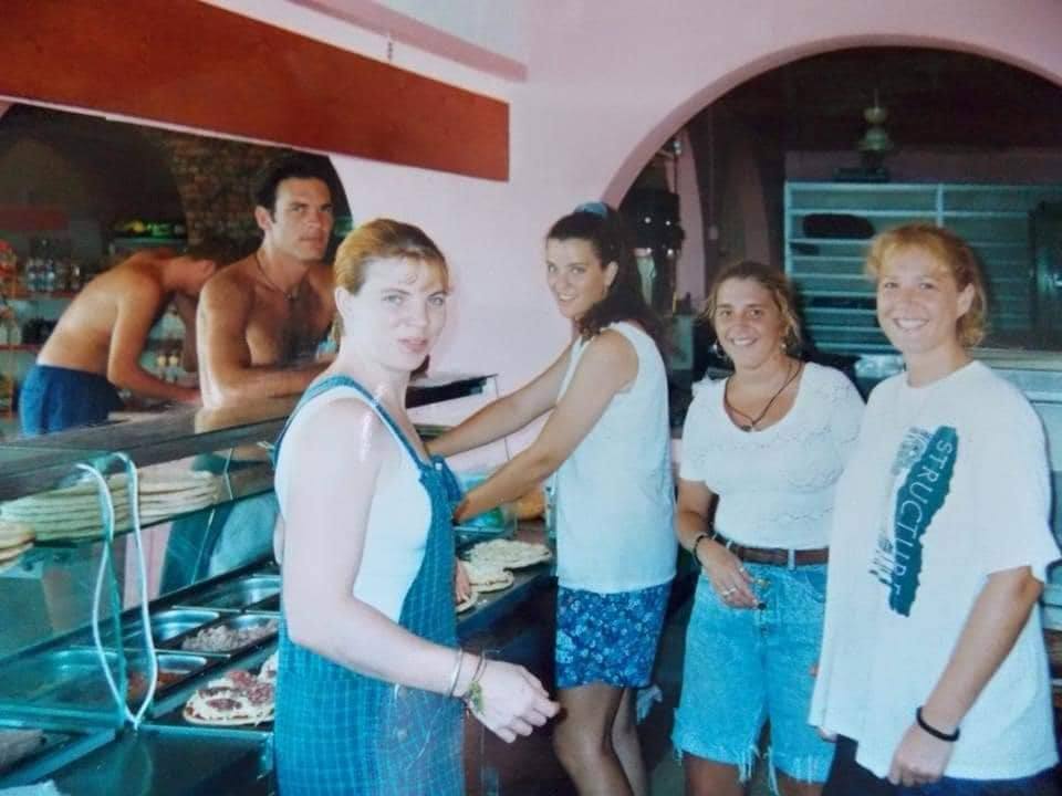 Three friends in a doorway · '90s
